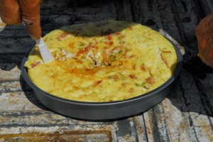 Kinford cutting cooked dutch oven omelet